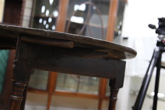 An 18th century circular fruitwood and oak cricket table, W.2ft 2in.